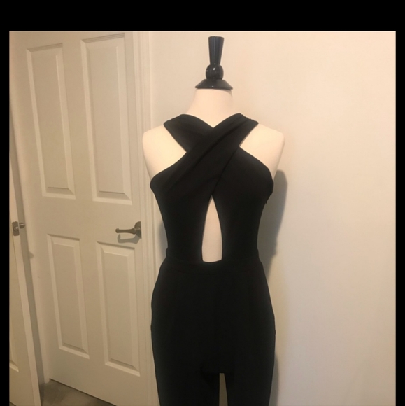 Express Black stretch jumpsuit. Low v neck front & opening below breast line. - Picture 1 of 9